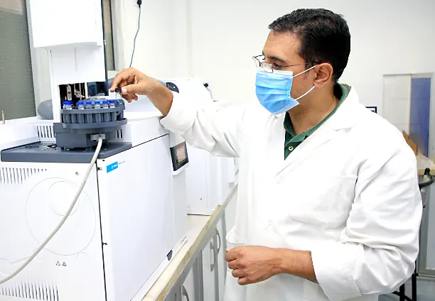 Analyst using lab equipment